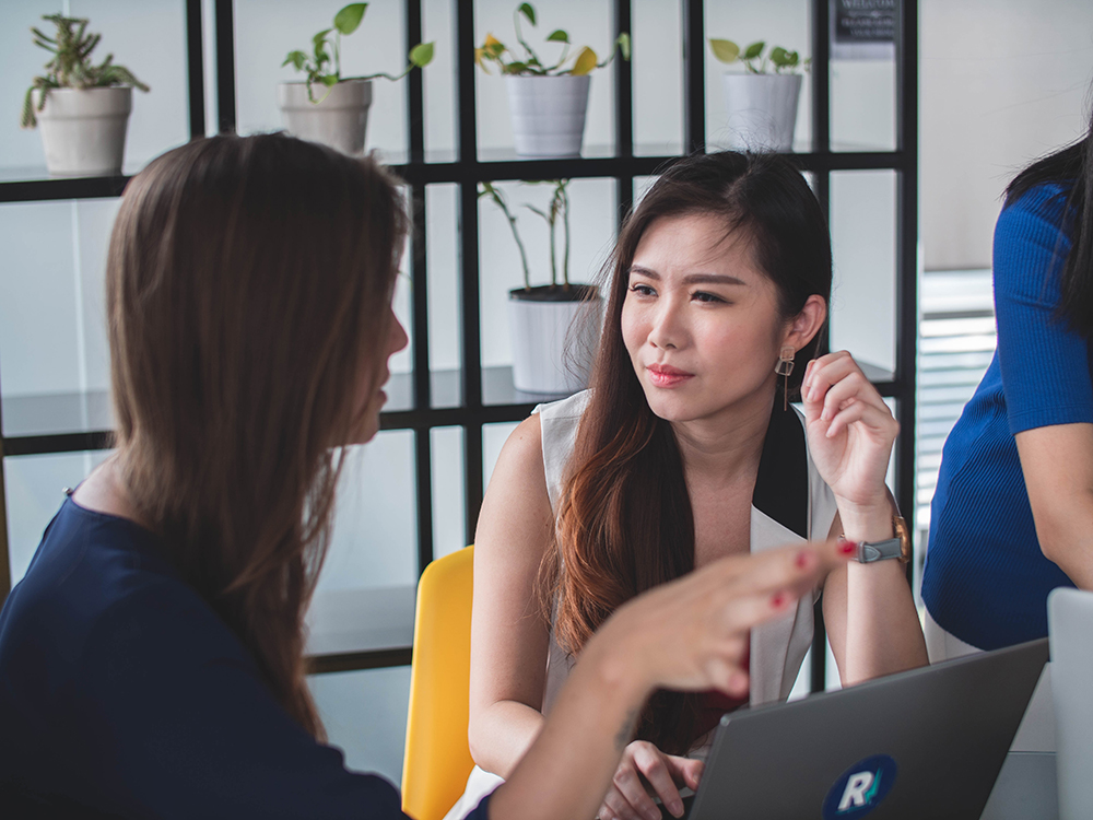 two woman in a meeting