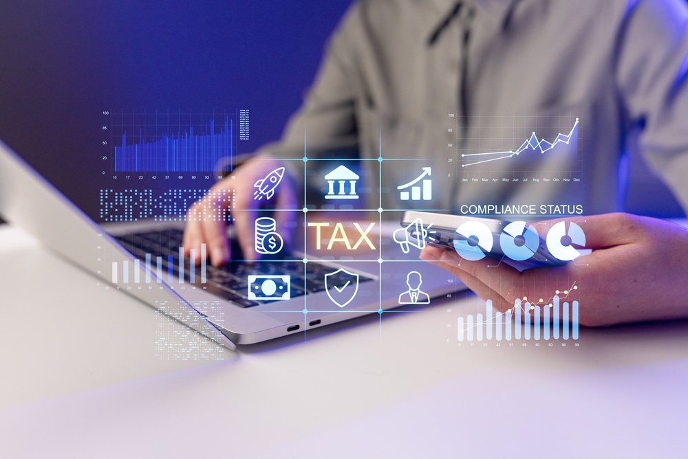 A,Person,Is,Using,A,Laptop,To,Check,Tax,Compliance